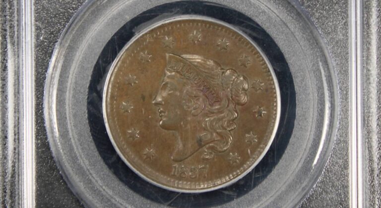 Close-up of the front side of a certified 1837 Coronet Head Cent, displayed in a guarantee package for collectors.