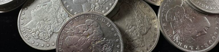 Collection of Morgan Silver Dollars, known for their high value among collectors, displayed to showcase different rare editions.