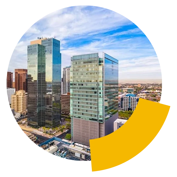 City skyline featuring modern glass buildings under a blue sky, with a yellow curved shape overlay.