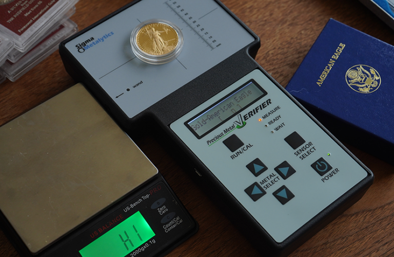 Gold coin on metal verifier